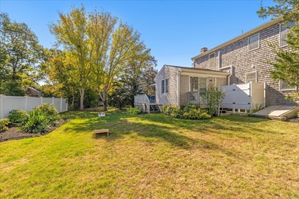 Yarmouth Cape Cod vacation rental - Backyard with cornhole and outdoor shower