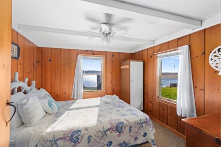 Eastham Cape Cod vacation rental - Primary bedroom with a queen bed and ocean views