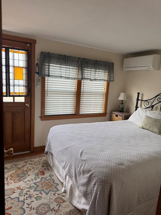 Chatham Oceanfront Condos Cape Cod vacation rental - First floor bedroom with queen bed, AC unit and TV.