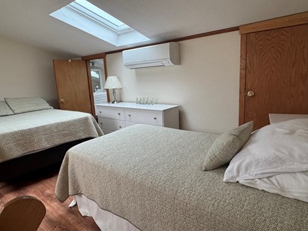 Chatham Oceanfront Condos Cape Cod vacation rental - Loft with double bed, twin bed, A/C unit, and half bath.