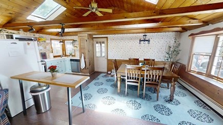 South Dennis Cape Cod vacation rental - Open concept living with open/kitchen/dining & door to porch
