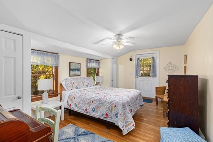 Eastham Cape Cod vacation rental - Primary bedroom with door to the front yard