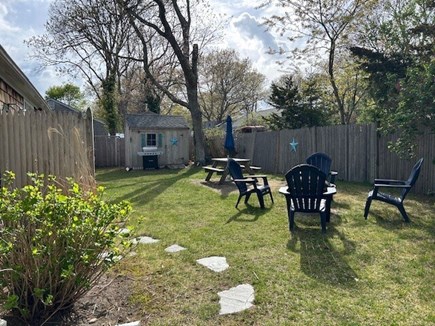 South Yarmouth Cape Cod vacation rental - Private back yard with fire pit, BBQ and patio