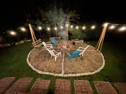 Brewster Cape Cod vacation rental - Fire pit area in back yard, off deck