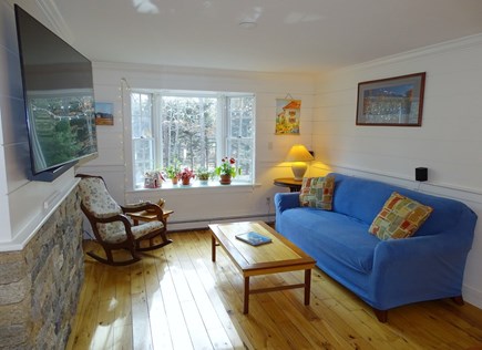 Brewster Cape Cod vacation rental - Family room with bay window and TV, adjacent to dining area