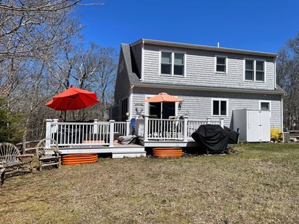 Eastham Cape Cod vacation rental - Back deck with dining area and lounge area