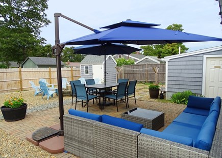 Dennis Port Cape Cod vacation rental - Terrific fenced back yard with plenty of seating, dining area