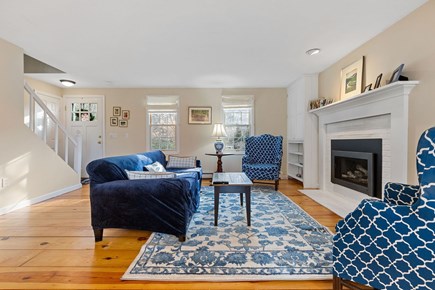 Dennis Cape Cod vacation rental - Living room with couch and decorative fireplace