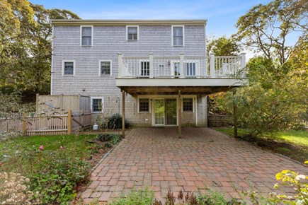 Dennis Cape Cod vacation rental - Back patio, yard and deck off of kitchen