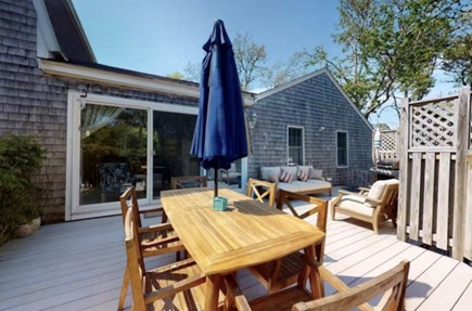 Chatham Cape Cod vacation rental - Expansive deck with an outdoor dining table and lounge area