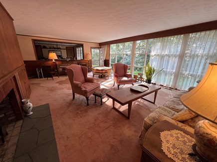 Bourne, Buzzards Bay Cape Cod vacation rental - Large living room with fireplace and solid mahogany paneling