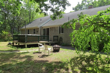 Eastham Cape Cod vacation rental - Back View of Deck and Firepit Area