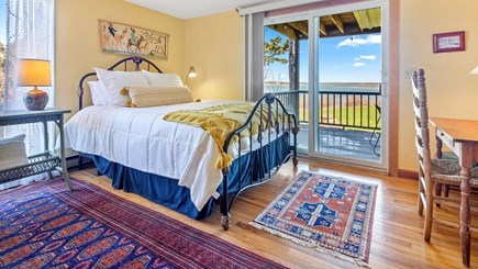 Orleans Cape Cod vacation rental - Primary bedroom with slider to lower level deck