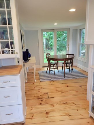 Brewster on the beach Cape Cod vacation rental - Dining area with gorgeous shady back yard