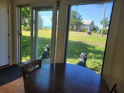 Brewster on the beach Cape Cod vacation rental - 2nd Dining or work area with large yard and water views