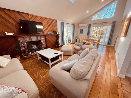 East Falmouth Cape Cod vacation rental - Expansive living room w/ smart TV, water views, board games