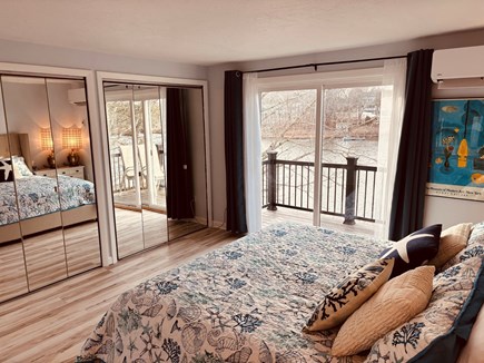 East Falmouth Cape Cod vacation rental - Primary suite with balcony and water views