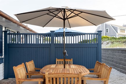 Dennis, Mayflower/Bayview Beach Cape Cod vacation rental - Front patio sitting/eating area.