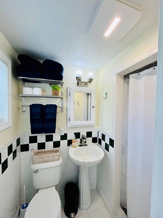 Yarmouth Cape Cod vacation rental - Private master bath with shower, classic tile, and cozy charm.
