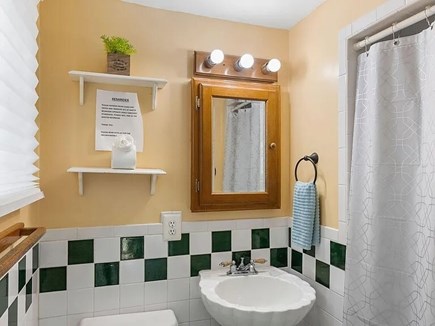 Yarmouth Cape Cod vacation rental - Private master bath with shower, classic tile, and cozy charm.