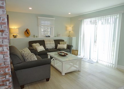 Eastham Cape Cod vacation rental - Lower level living room with slider to back patio 