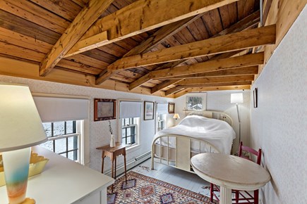 Truro Cape Cod vacation rental - Second upper level bedroom with a queen bed and exposed beams