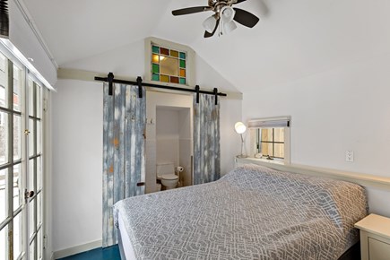 Truro Cape Cod vacation rental - Bedroom with a queen bed & ensuite bathroom with a standup shower