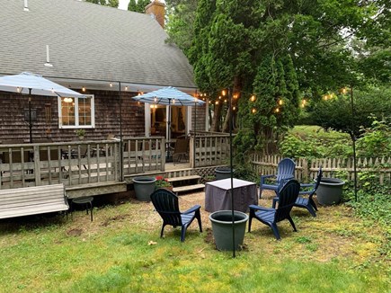 Chatham Cape Cod vacation rental - Amazing Fenced in Yard with Firepit and outdoor dining on deck