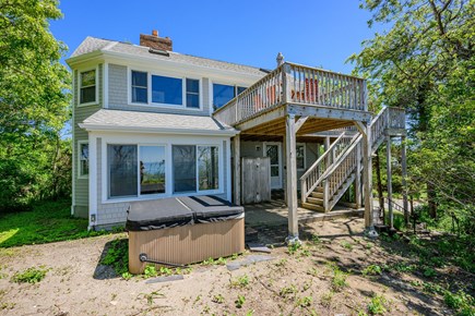 Brewster Cape Cod vacation rental - Water Facing Side of Home with Deck. Outdoor Shower, and Hot Tub