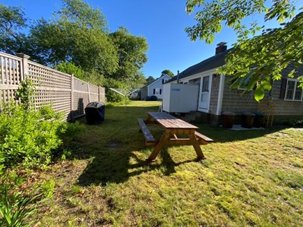 Dennis Port Cape Cod vacation rental - Back yard with gas grill and picnic table