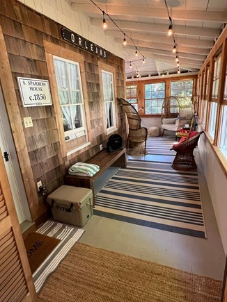 South Orleans Cape Cod vacation rental - Front Porch from Laundry Toward Egg Chair and Peacock Chair.