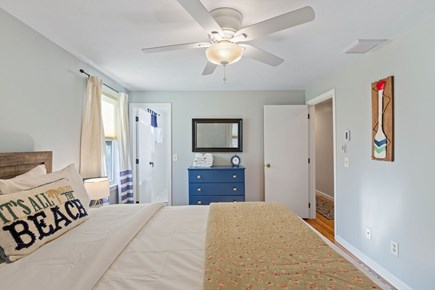 Brewster Cape Cod vacation rental - Primary bedroom suite w/king bed, ceiling fan, renovated ensuite.