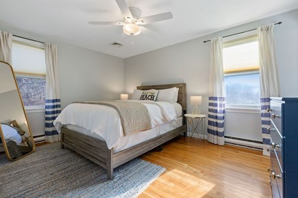 Brewster Cape Cod vacation rental - Primary bedroom suite w/king bed, ceiling fan, renovated ensuite.