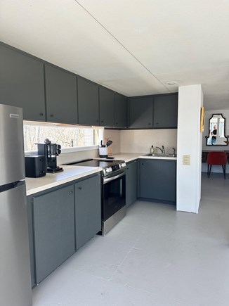 Truro Cape Cod vacation rental - Eat in kitchen with sliders to deck and BBQ