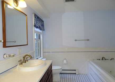 Eastham Cape Cod vacation rental - Queen bedroom bath with double sinks and Jacuzzi tub