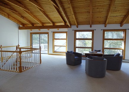 Eastham Cape Cod vacation rental - Other side of large upstairs TV room, shows slider to upper deck