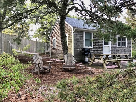 Chequessett Village, Wellfleet Cape Cod vacation rental - Cottage exterior with patio and grill