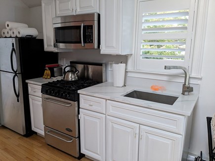 Harwich Port Cape Cod vacation rental - Kitchen with marble top, microwave, stove, refrigerator