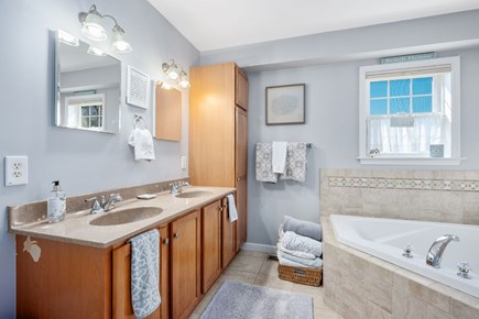 Sagamore Beach Cape Cod vacation rental - Bathroom 2 (Primary Bathroom): Stall shower and soaking tub – 1st Floor