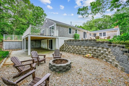 Centerville Cape Cod vacation rental - Fire pit in backyard