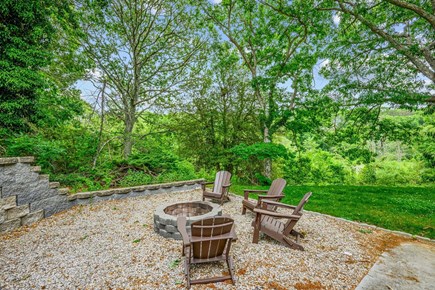Centerville Cape Cod vacation rental - Fire pit in backyard