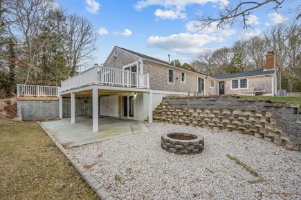 Centerville Cape Cod vacation rental - Fire pit in backyard