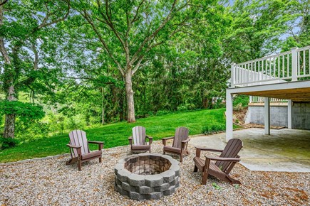 Centerville Cape Cod vacation rental - Fire pit in backyard