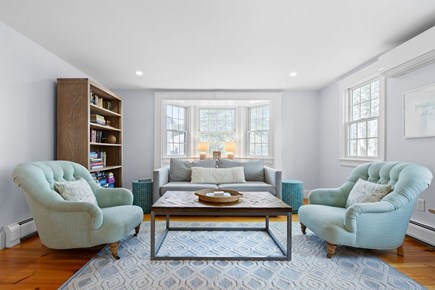 Chatham  Cape Cod vacation rental - Living room/office with a seating area, desk, books & games.
