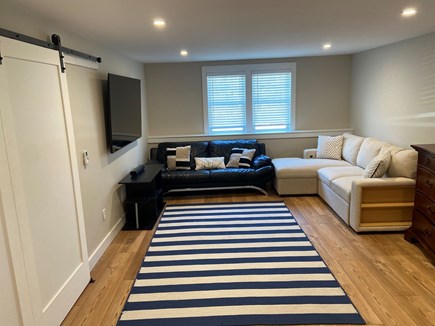 Harwich Cape Cod vacation rental - Downstairs area- game room/tv living area