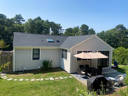 Harwich Cape Cod vacation rental - Lower backyard view with outdoor shower, upper space not in view