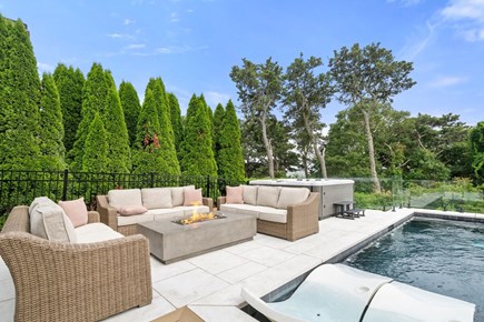 Chatham Cape Cod vacation rental - Fire table and hot tub by the pool