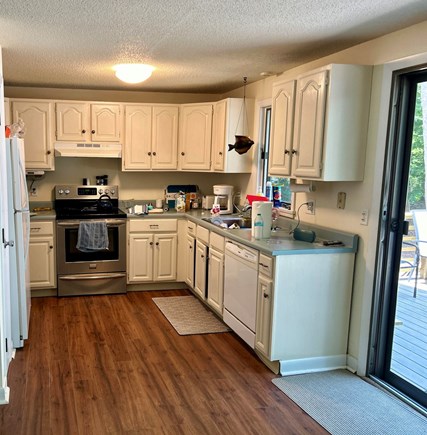 East Harwich Cape Cod vacation rental - Kitchen with slider to deck