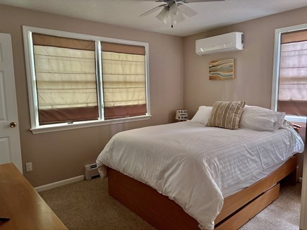 East Falmouth Cape Cod vacation rental - Master bedroom with en suite bathroom, large closets, and AC.
