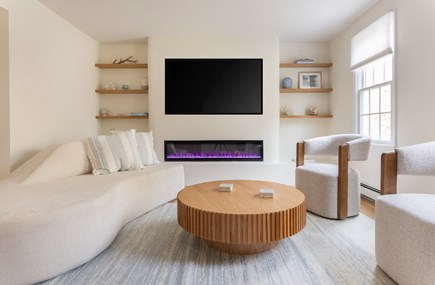 Mashpee Cape Cod vacation rental - Family room with cozy fireplace and 65 inch TV